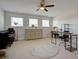 Spacious bonus room with natural light, neutral walls and carpet, complemented by a decorative rug at 3522 Habenaria Rd, Mount Pleasant, SC 29466