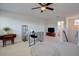 Bright bonus room featuring a ceiling fan, plush carpet, and a versatile layout for work or relaxation at 3522 Habenaria Rd, Mount Pleasant, SC 29466