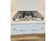 Stainless steel cooktop with white cabinets and drawers, and brushed nickel pulls at 3522 Habenaria Rd, Mount Pleasant, SC 29466