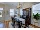 Well-lit dining area featuring a large dining table set and a stylish chandelier at 3522 Habenaria Rd, Mount Pleasant, SC 29466