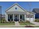 Charming single-Gathering home with a cozy front porch, pristine landscaping, and a two-car garage at 3522 Habenaria Rd, Mount Pleasant, SC 29466