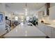 Spacious kitchen showcases a large center island and is open to the living and dining areas at 3522 Habenaria Rd, Mount Pleasant, SC 29466