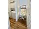 Laundry area with new white washer and dryer, cabinet storage, and hardwood floors at 3522 Habenaria Rd, Mount Pleasant, SC 29466