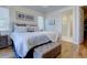 Bright and spacious bedroom with large bed and bench seating at 3522 Habenaria Rd, Mount Pleasant, SC 29466