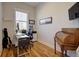 Inviting home office with desk, chair, hardwood floors, and natural light at 3522 Habenaria Rd, Mount Pleasant, SC 29466