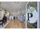 Bright, open floorplan featuring beautiful hardwood floors connecting the kitchen, living area and staircase at 3522 Habenaria Rd, Mount Pleasant, SC 29466