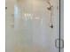Modern shower with frameless glass door, sleek fixtures, and tiled walls at 3522 Habenaria Rd, Mount Pleasant, SC 29466