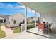 Covered back porch includes an outdoor dining area perfect for entertaining at 3537 Sewel Ave, Mount Pleasant, SC 29466