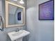 Powder room features pedestal sink, framed mirror and tasteful decor at 3537 Sewel Ave, Mount Pleasant, SC 29466