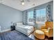 Bright bedroom with cozy seating, large windows, and stylish curtains offers a comfortable retreat at 3537 Sewel Ave, Mount Pleasant, SC 29466