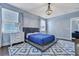 Bedroom with modern chandelier, platform bed, hardwood floors, neutral walls, and plenty of natural light at 3537 Sewel Ave, Mount Pleasant, SC 29466