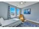 Cozy bedroom features bright light, blue walls, and a yellow chair at 3537 Sewel Ave, Mount Pleasant, SC 29466