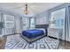Bright bedroom with modern chandelier, platform bed, hardwood floors, neutral walls, and windows at 3537 Sewel Ave, Mount Pleasant, SC 29466