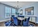 Elegant dining room featuring a chandelier, large windows, and a stylish sideboard at 3537 Sewel Ave, Mount Pleasant, SC 29466