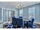 Well-lit dining room with views to living areas, featuring French doors and stylish decor at 3537 Sewel Ave, Mount Pleasant, SC 29466