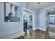 Stylish entryway showcasing hardwood floors, decorative artwork, and an open view into the dining area at 3537 Sewel Ave, Mount Pleasant, SC 29466