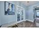Stylish entryway showcasing hardwood floors, decorative artwork, and French doors leading to other spaces at 3537 Sewel Ave, Mount Pleasant, SC 29466