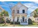 Charming two-story home with a welcoming front porch and beautifully landscaped yard at 3537 Sewel Ave, Mount Pleasant, SC 29466