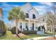 Charming home with a welcoming porch, a palm tree, and nice landscaping at 3537 Sewel Ave, Mount Pleasant, SC 29466