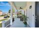 Inviting front porch featuring a cozy seating area, ceiling fan, and pleasant outdoor ambiance at 3537 Sewel Ave, Mount Pleasant, SC 29466