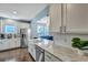 Bright kitchen with white cabinets, stainless steel appliances, and a view into the living room at 3537 Sewel Ave, Mount Pleasant, SC 29466