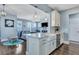 Open kitchen featuring a breakfast bar, white cabinetry, and stainless steel appliances at 3537 Sewel Ave, Mount Pleasant, SC 29466
