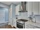 Well-lit kitchen features stainless steel appliances, white cabinets, subway tile backsplash and beautiful countertops at 3537 Sewel Ave, Mount Pleasant, SC 29466