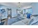 Open-concept living area featuring a comfortable sectional and view into the modern kitchen at 3537 Sewel Ave, Mount Pleasant, SC 29466