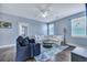 Cozy living room with stylish area rug, comfortable sofas and chair perfect for relaxing and entertaining at 3537 Sewel Ave, Mount Pleasant, SC 29466