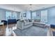 Bright living room with hardwood floors, stylish lighting, and a comfortable gray sectional sofa at 3537 Sewel Ave, Mount Pleasant, SC 29466