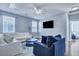 Bright living room with modern decor, hardwood floors, and plush white sofa offers comfortable seating at 3537 Sewel Ave, Mount Pleasant, SC 29466