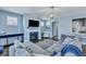 Cozy living room showcasing a fireplace, TV, and comfortable seating area with light blue walls at 3537 Sewel Ave, Mount Pleasant, SC 29466