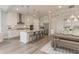Open concept kitchen with gray wood floors, stainless appliances, pendant lighting, and plenty of storage at 4004 Flatiron Dr, Charleston, SC 29414
