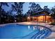 Inviting community pool with a charming wooden clubhouse in a lush, wooded setting at 4021 Flatiron Dr, Charleston, SC 29414