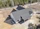 Aerial view of home featuring modern farmhouse design and dark grey roof at 4036 Azalea Farms Way, McClellanville, SC 29458