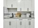 Kitchen with subway tile backsplash and white cabinetry at 4036 Azalea Farms Way, McClellanville, SC 29458