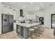 Modern kitchen featuring a large center island with seating and stainless steel appliances at 4036 Azalea Farms Way, McClellanville, SC 29458