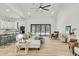 Bright, open-concept living room featuring modern furnishings and access to the kitchen at 4036 Azalea Farms Way, McClellanville, SC 29458