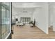 Spacious living room with hardwood floors, high ceilings, and natural light from the large sliding doors at 4036 Azalea Farms Way, McClellanville, SC 29458