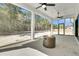 Covered patio featuring a modern fire pit and views of the surrounding wooded landscape at 4036 Azalea Farms Way, McClellanville, SC 29458