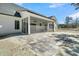 View of home's screened porch, ceiling fans, and brick patio at 4036 Azalea Farms Way, McClellanville, SC 29458