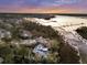 Panoramic aerial shot overlooking a coastal estate with expansive water views and verdant landscaping at 4051 Colonel Vanderhorst Cir, Mount Pleasant, SC 29466