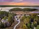 Stunning aerial view of estate home, winding driveway and waterfront location at 4051 Colonel Vanderhorst Cir, Mount Pleasant, SC 29466