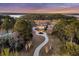 Beautiful aerial view of a stately home with a long winding driveway at 4051 Colonel Vanderhorst Cir, Mount Pleasant, SC 29466