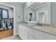 Stylish bathroom with dual sinks, granite countertops, and a walk-in closet at 4051 Colonel Vanderhorst Cir, Mount Pleasant, SC 29466