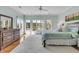 Tranquil bedroom with large windows offering views and a luxurious king-sized bed at 4051 Colonel Vanderhorst Cir, Mount Pleasant, SC 29466