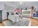Spacious bedroom featuring a comfortable bed, soft rug and a large window showcasing the outdoor view at 4051 Colonel Vanderhorst Cir, Mount Pleasant, SC 29466