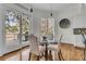 Bright breakfast nook features a glass table, views of the backyard and access to the deck at 4051 Colonel Vanderhorst Cir, Mount Pleasant, SC 29466