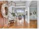 Grand entryway featuring hardwood floors, high ceilings, staircase, and a glimpse into the living room at 4051 Colonel Vanderhorst Cir, Mount Pleasant, SC 29466