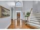 Inviting entryway with hardwood floors, staircase, and a view of the front door at 4051 Colonel Vanderhorst Cir, Mount Pleasant, SC 29466